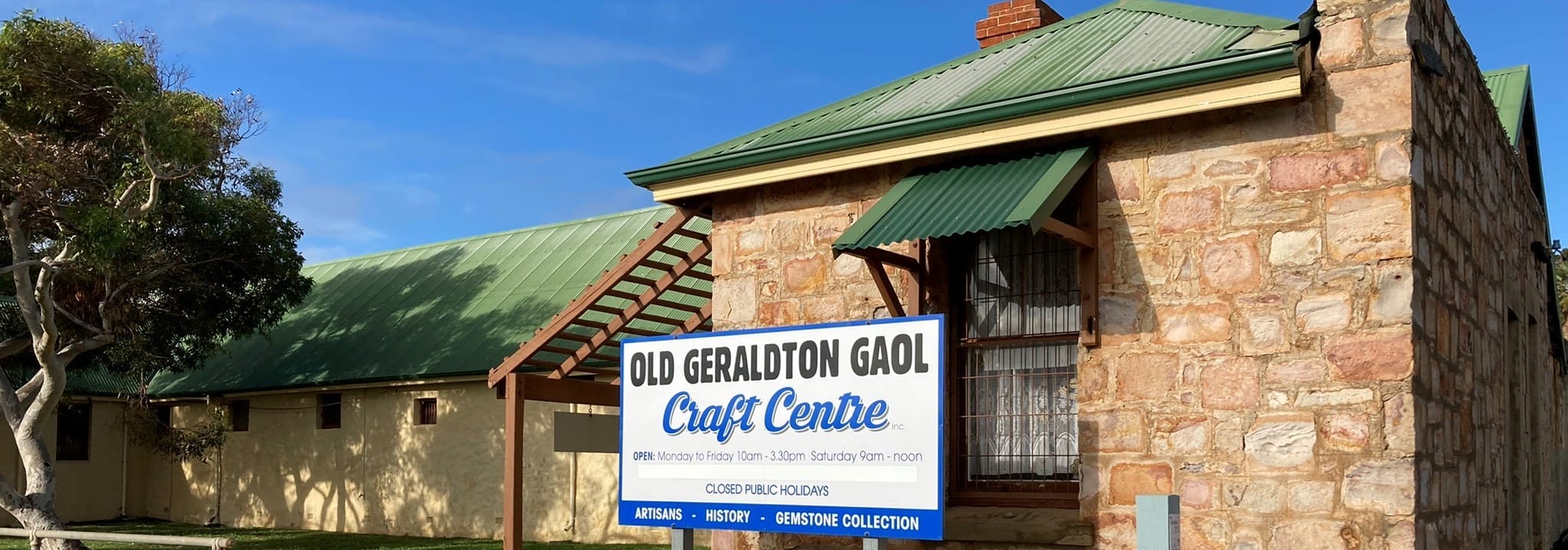 old geraldton gaol craft centre historic look with stone walls and a green metal roof