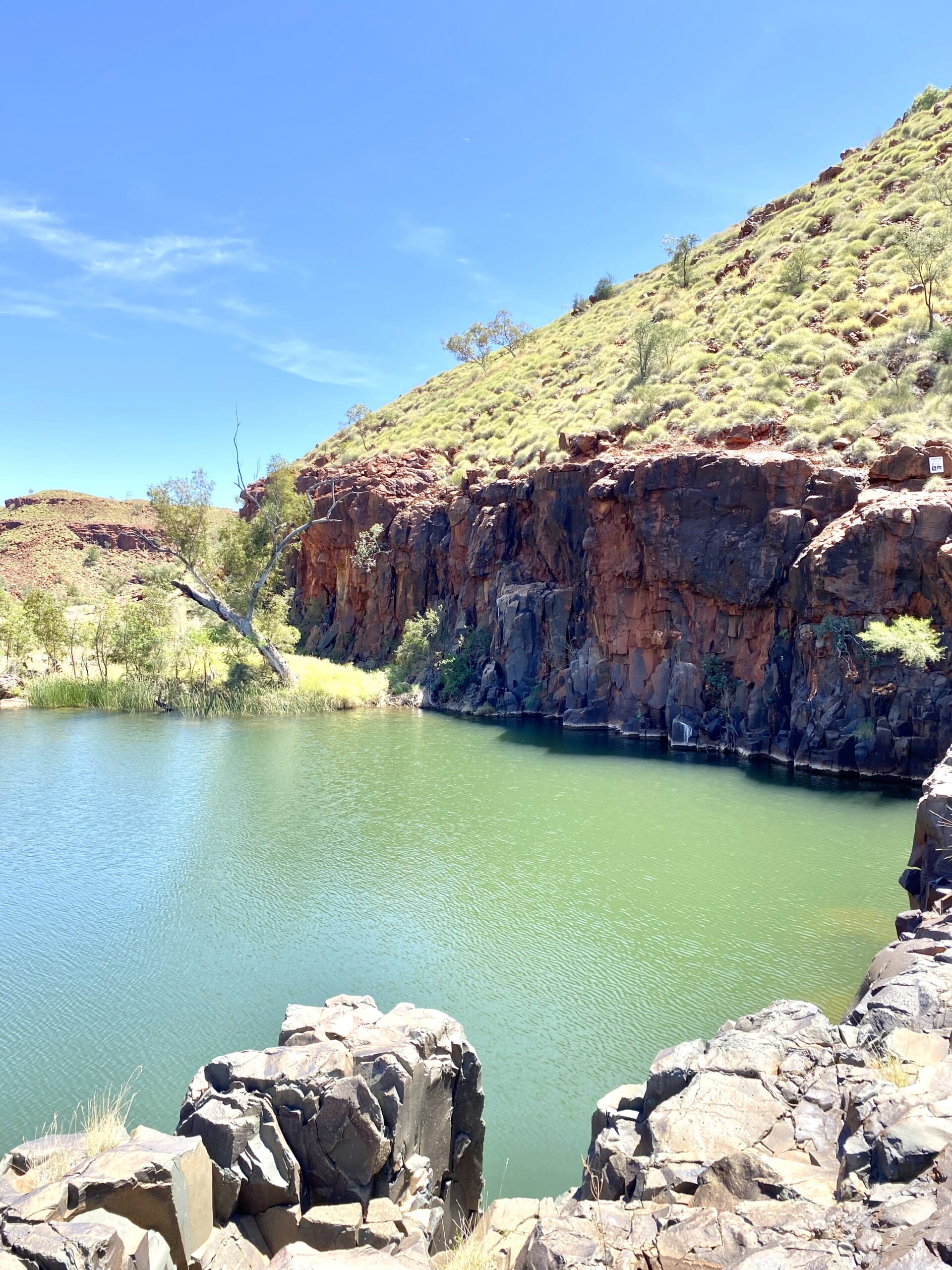 Bright rocky hillside waterhole